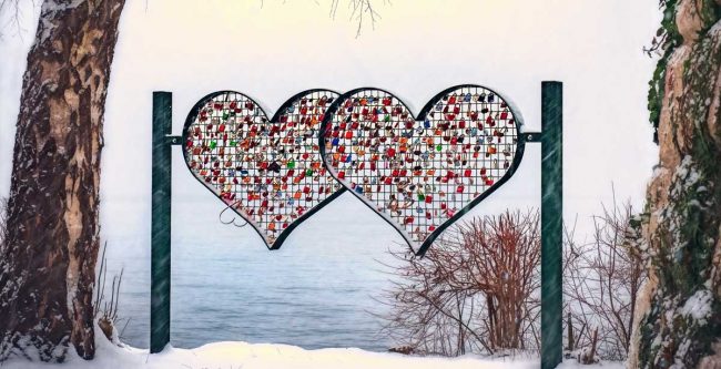 Heart sculpture near the water in winter