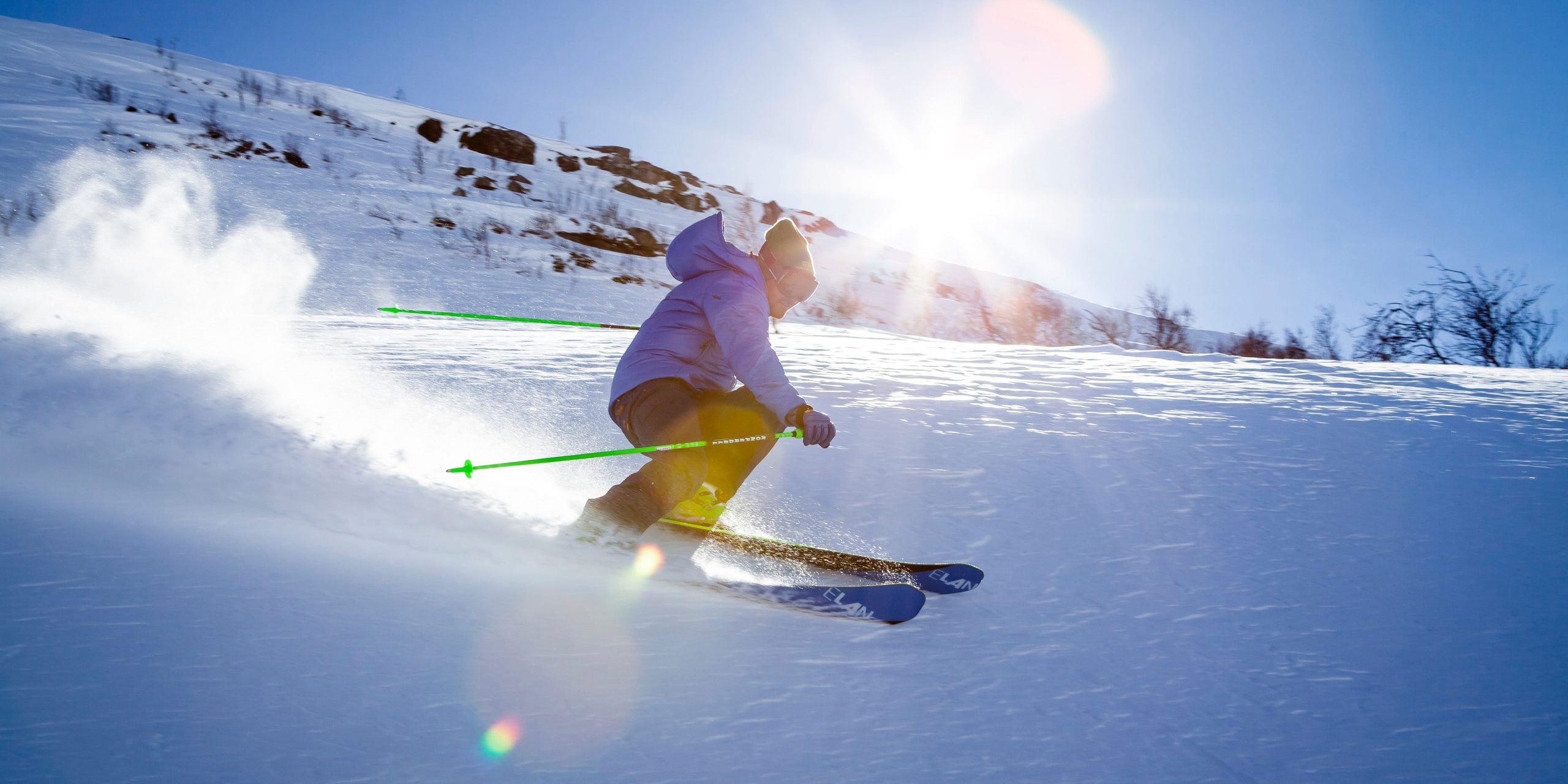 Man skiing down a mountain of fresh powder